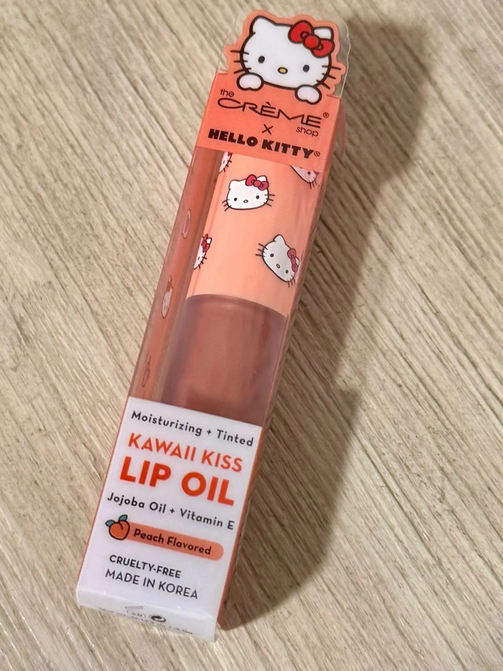 The Creme Shop x Hello Kitty - Kawaii Kiss Moisturizing Lip Oil in Peach - NEW